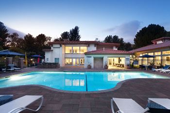The swimming pool at the resort at dusk